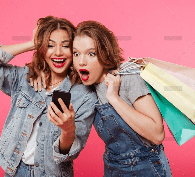 demo-attachment-1429-shocked-two-women-friends-holding-shopping-bags-using-mobile-phone